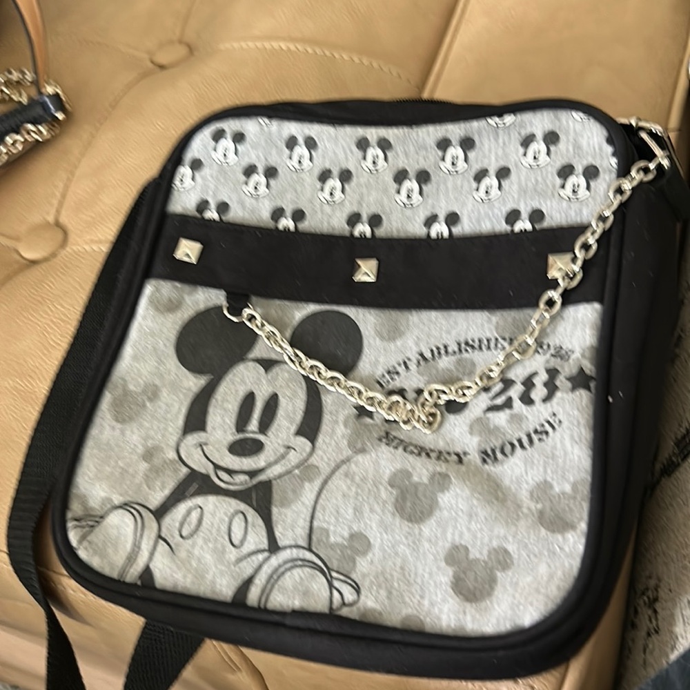 Disney’s Mickey established 1928 lounge fly crossbody bag with chain accent